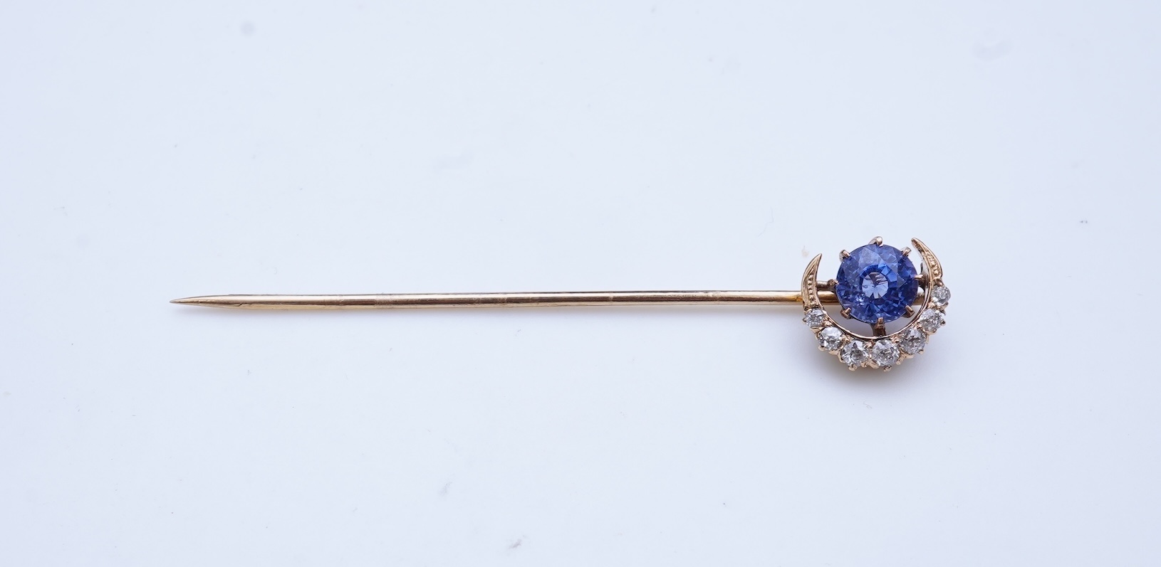 A sapphire and diamond tie pin, late 19th century
